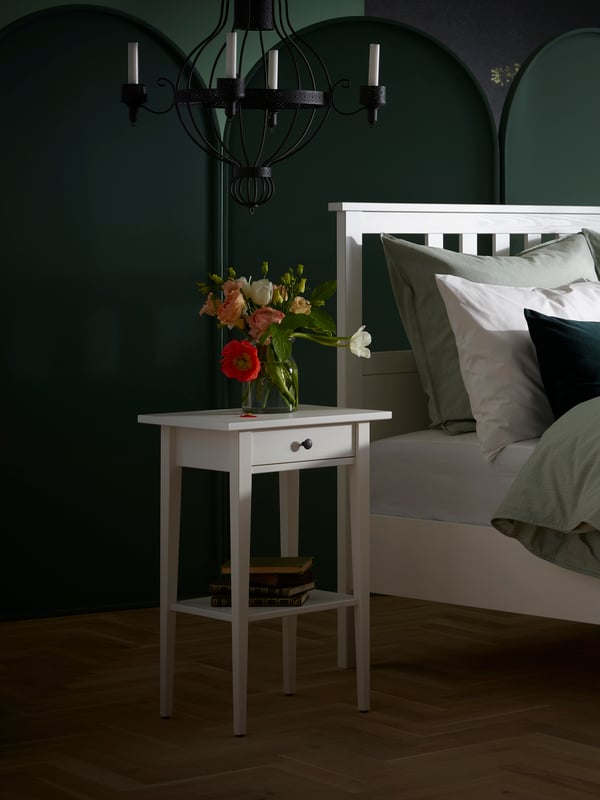 A white stain HEMNES bedside table in the bedroom