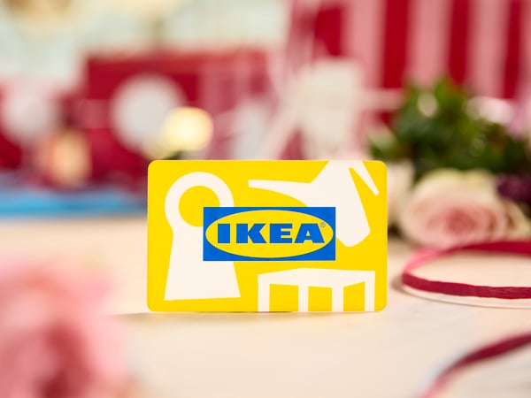 IKEA gift card on a festively decorated table.