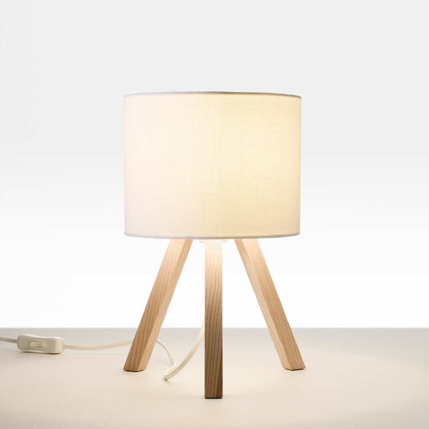 A STORSEGEL table lamp, seen slightly from below so that it looks like a space rocket on a launchpad.