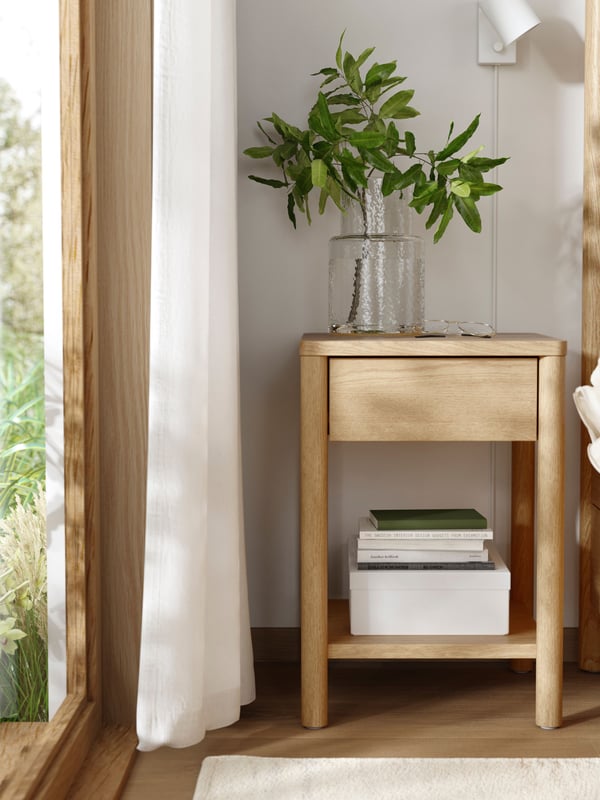 An oak veneer TONSTAD bedside table