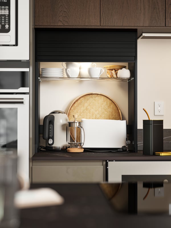 A straight kitchen has a black TITTEBO tambour storage for smaller appliances on the countertop and a NUMRERAD wine cooler.