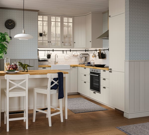A white INGOLF bar stool with backrest in the kitchen