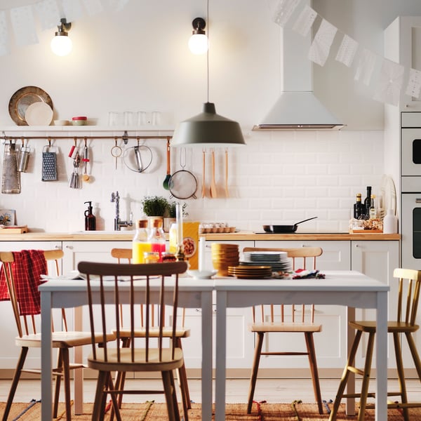 A white MATTRADITION wall mounted extractor hood in the kitchen