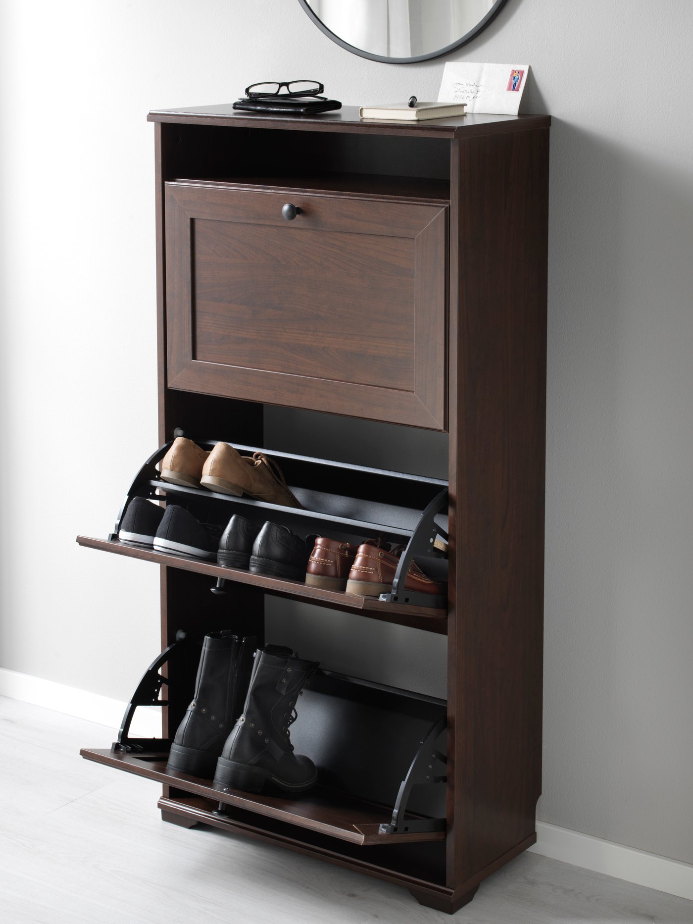 A brown BRUSALI shoe cabinet with 3 compartments