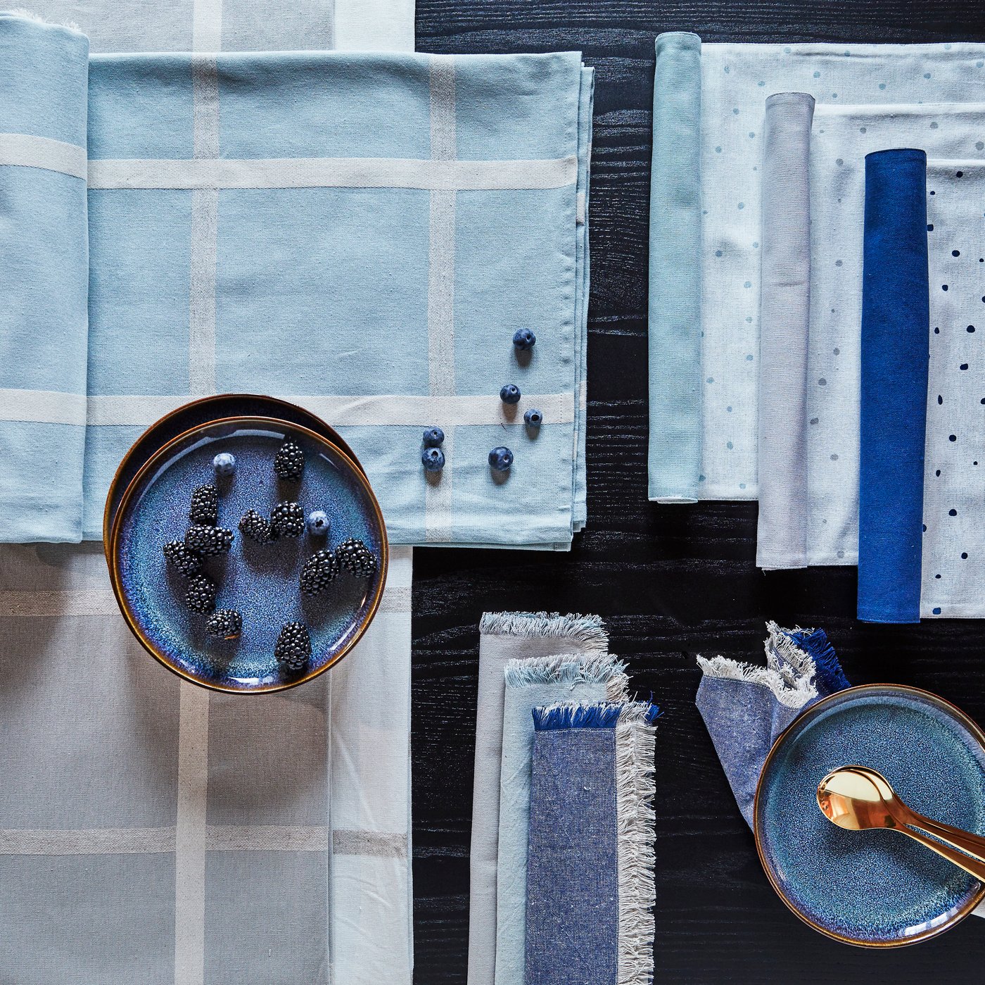 A beige/white NISSÖGA tablecloth