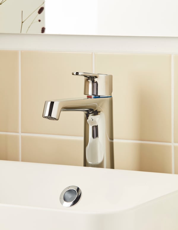 A chrome-plated BROGRUND wash-basin mixer tap in the bathroom