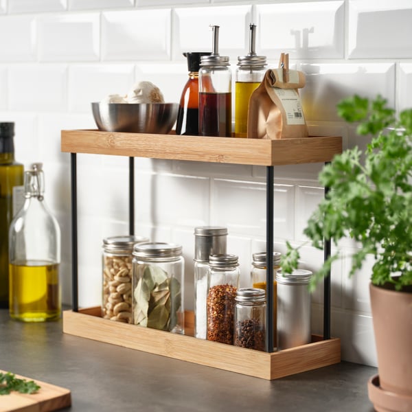 A metal/bamboo NÅLBLECKA kitchen countertop organiser