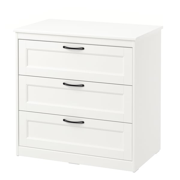 A white SONGESAND chest of three drawers in the NA