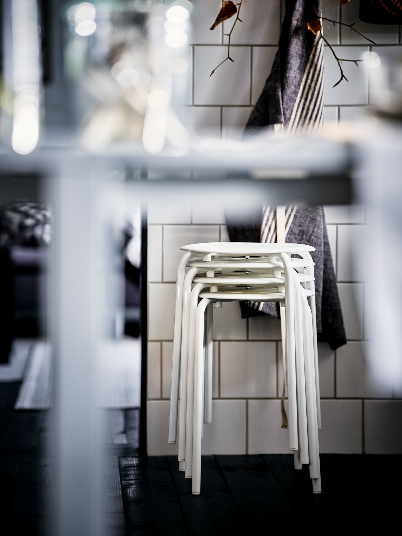 A white MARIUS stool in the dining room