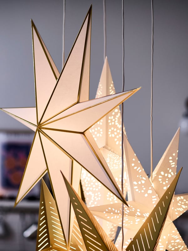 A white/gold-colour STRÅLA lampshade