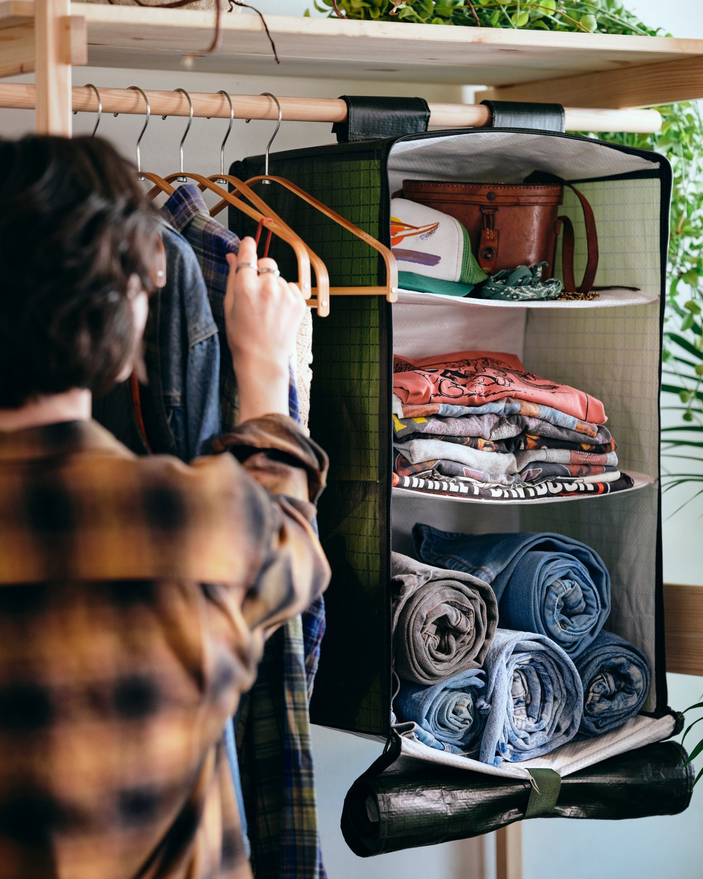 A pine KRONÖREN open wardrobe in the bedroom