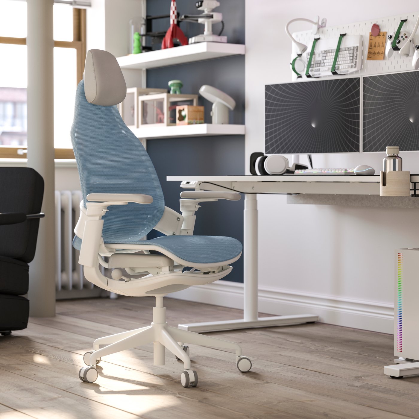 A BÄSTBOLL gaming chair is by a white MÅLOMRÅDE gaming desk. Collectibles and gaming gear decorate the daylight-filled room.