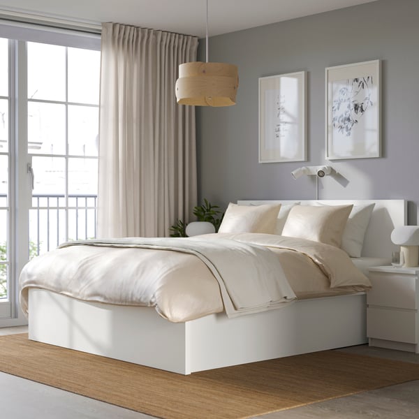 A white MALM ottoman bed