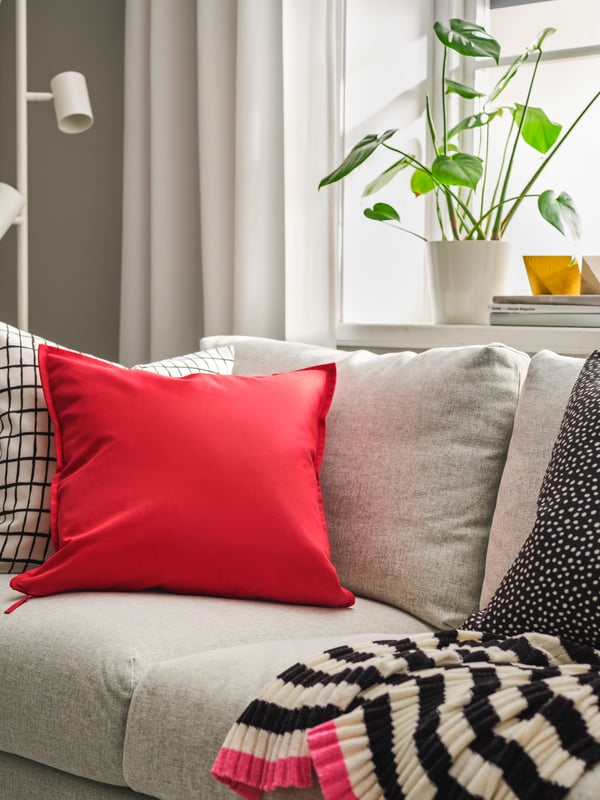 A red GURLI cushion cover