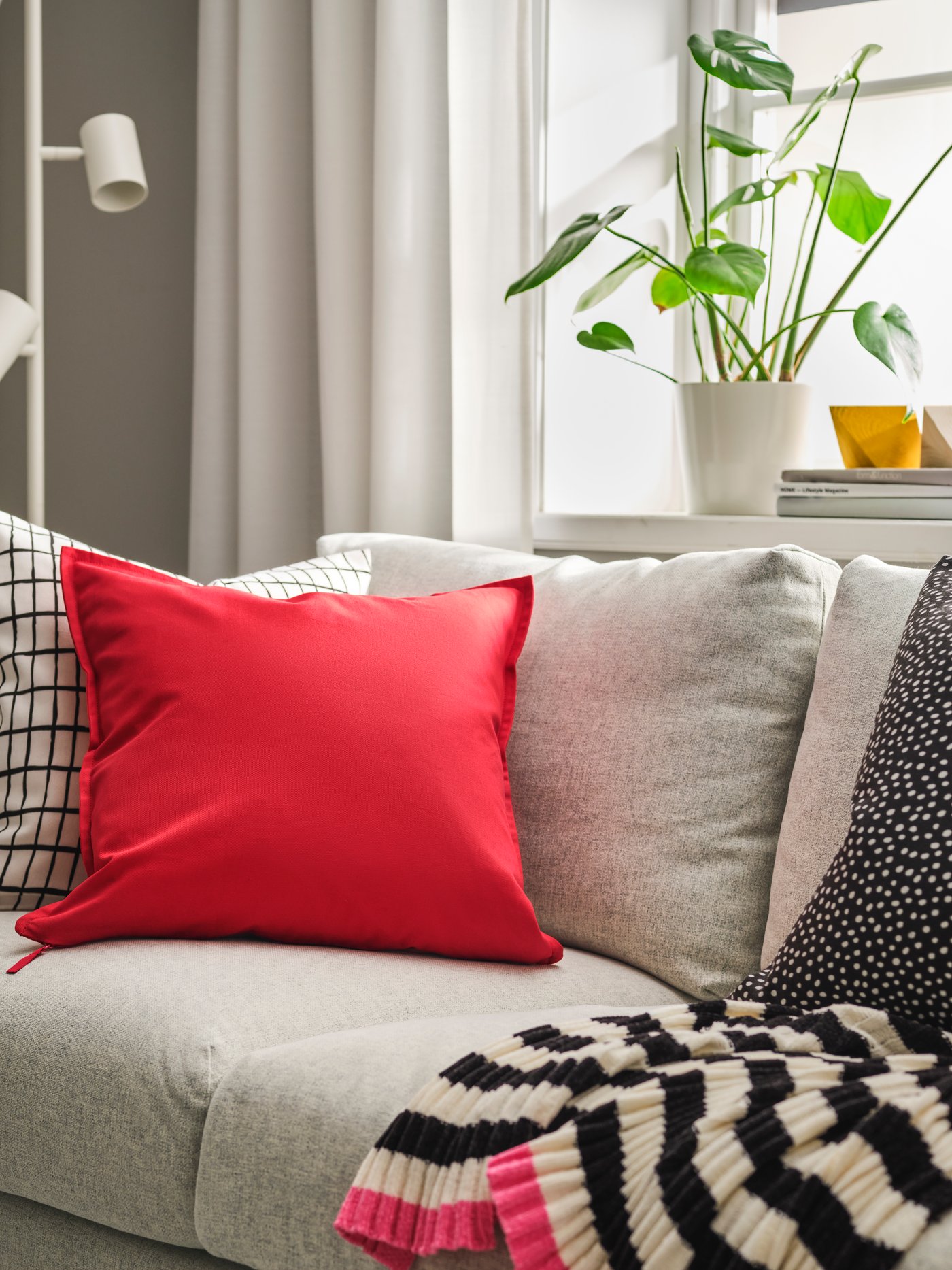 A red GURLI cushion cover