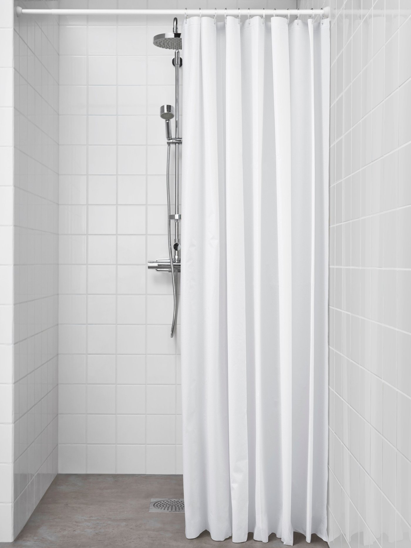 A white BJÄRSEN shower curtain
