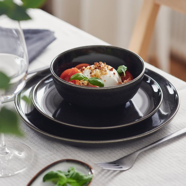 A dark grey GLADELIG bowl