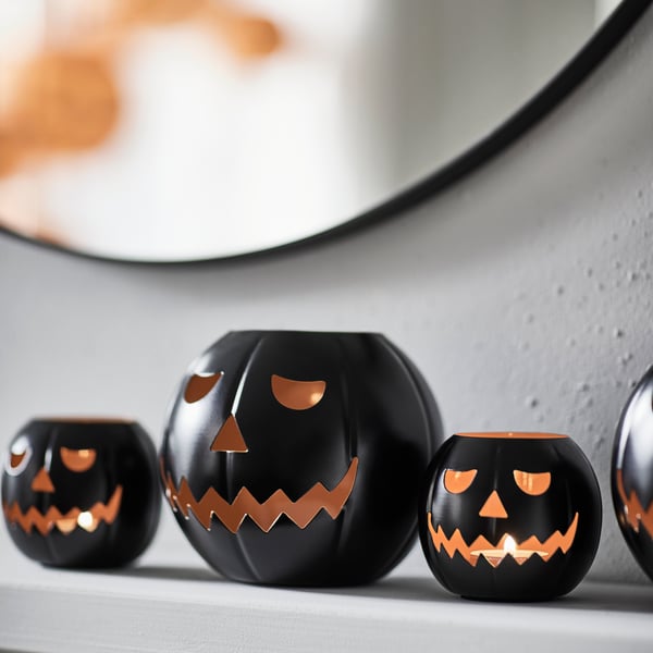 A pumpkin black KUSTFYR tealight holder