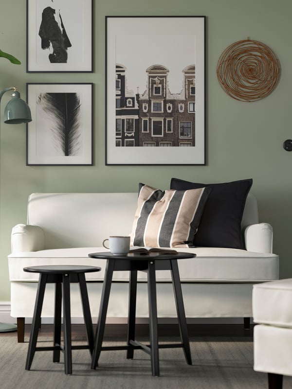 An anthracite beige/stripe pattern KORALLBUSKE cushion cover in the living room