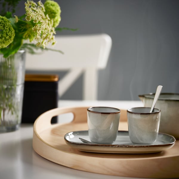 A grey GLADELIG espresso cup