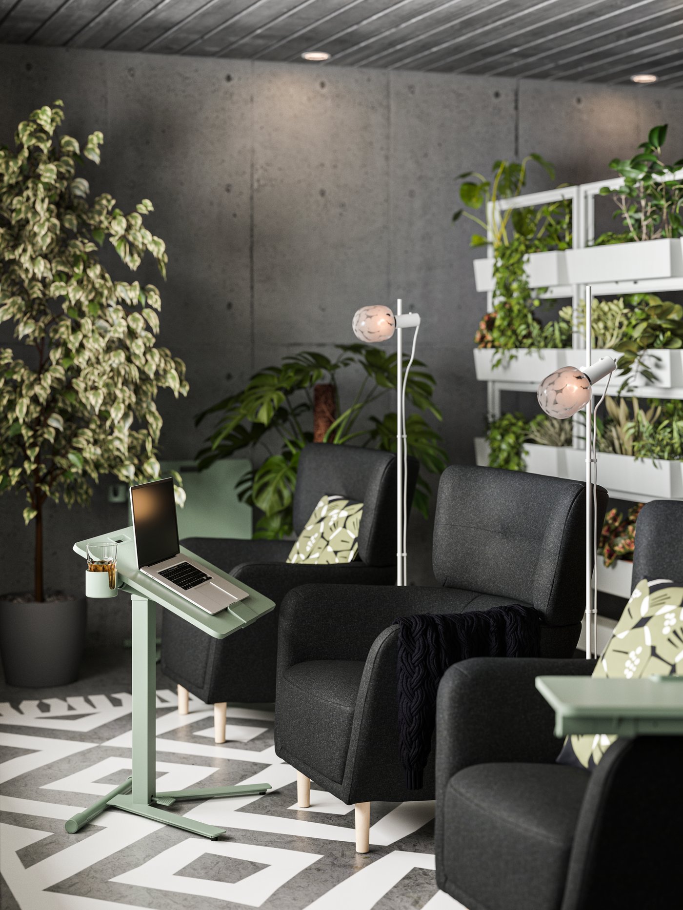 Three armchairs and a MITTZON foldable laptop stand with castors are surrounded by greenery in a space with concrete walls.