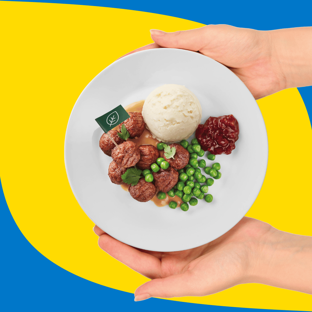 Hands hold a plate of plant balls