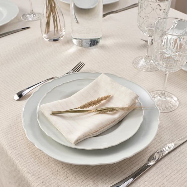 En randig beige SILVERARV servett.
