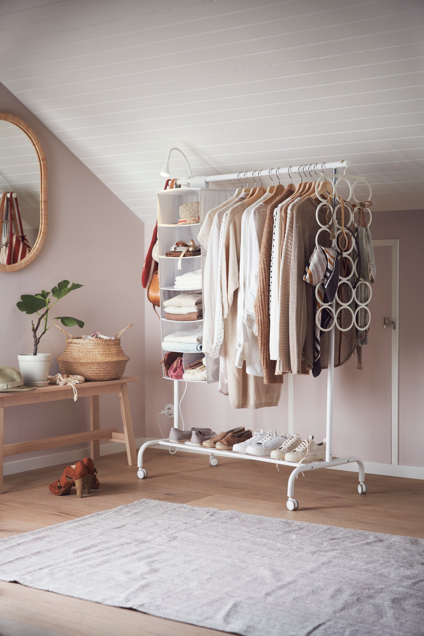 A white RIGGA clothes rack in the bedroom