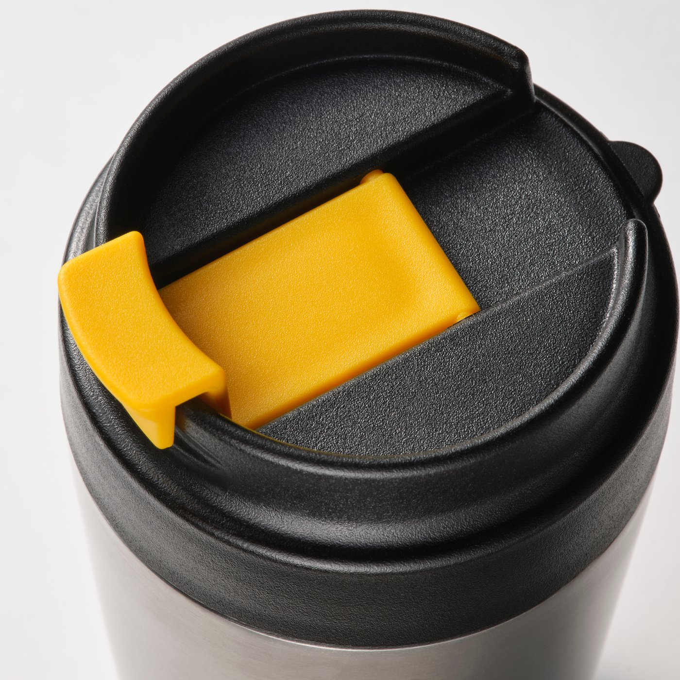 A stainless steel/black ENVÄLDIG insulated travel mug in the NA