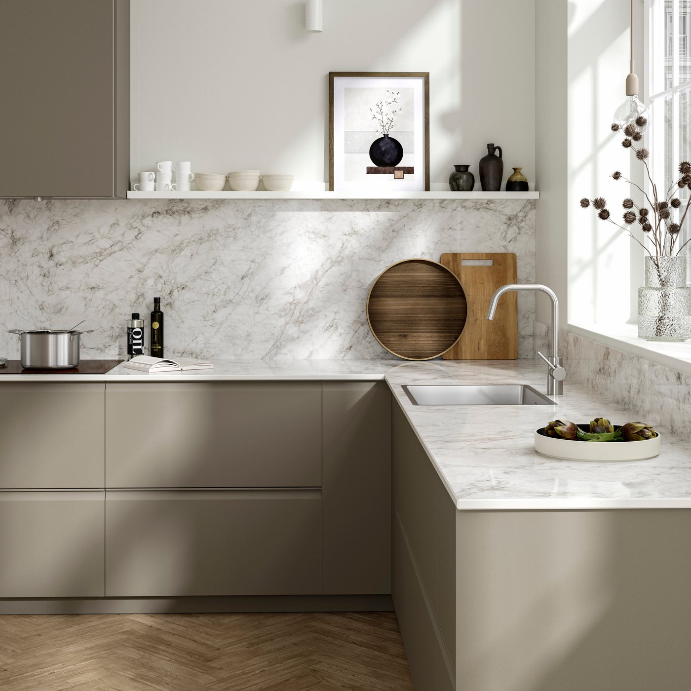 A beige modern kitchen with a porcelain white marble effect worktop