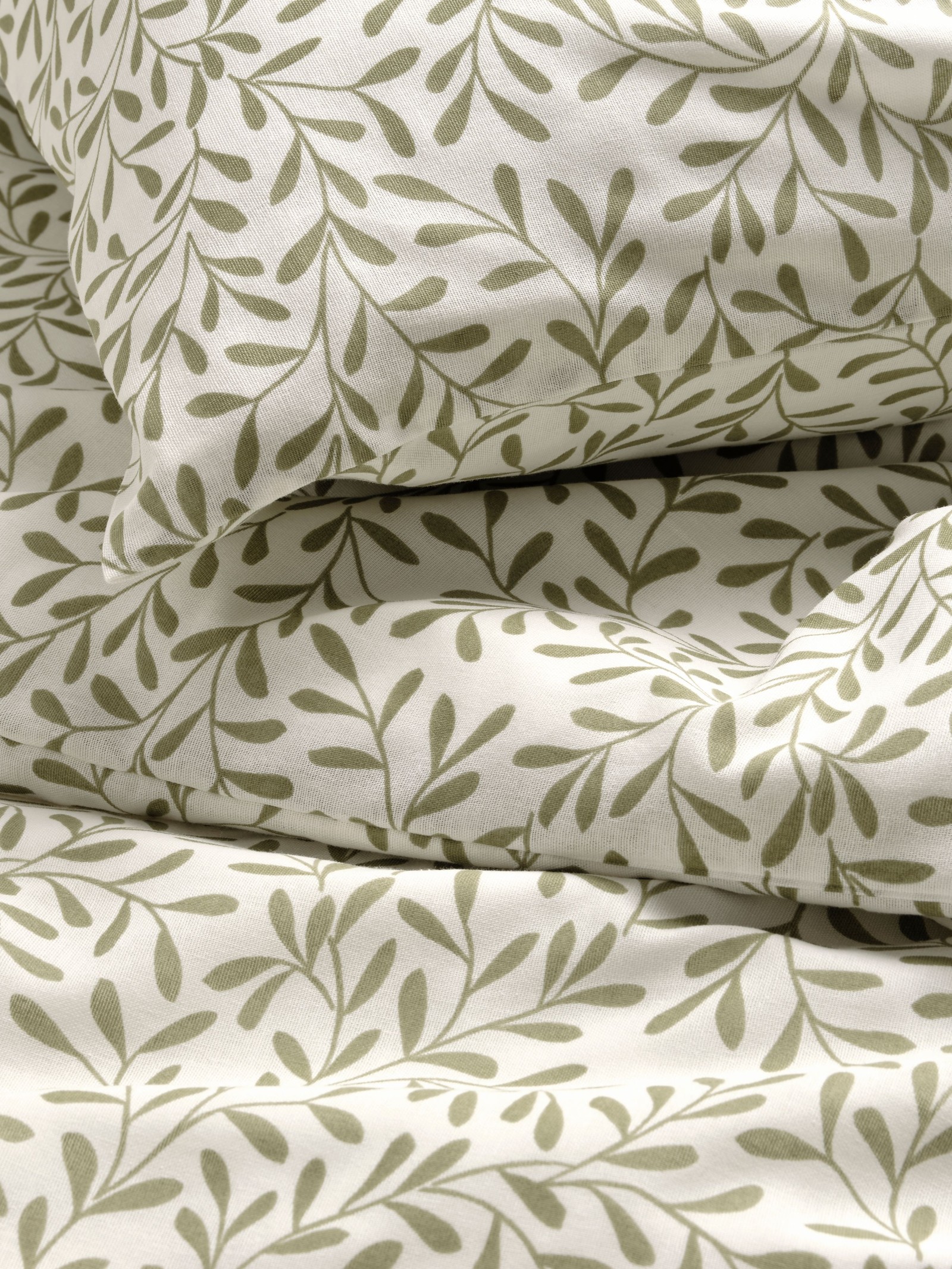 A white/green SORGMANTEL duvet cover and pillowcase