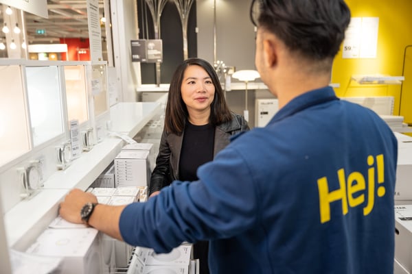IKEA Co-worker is attending to customer questions