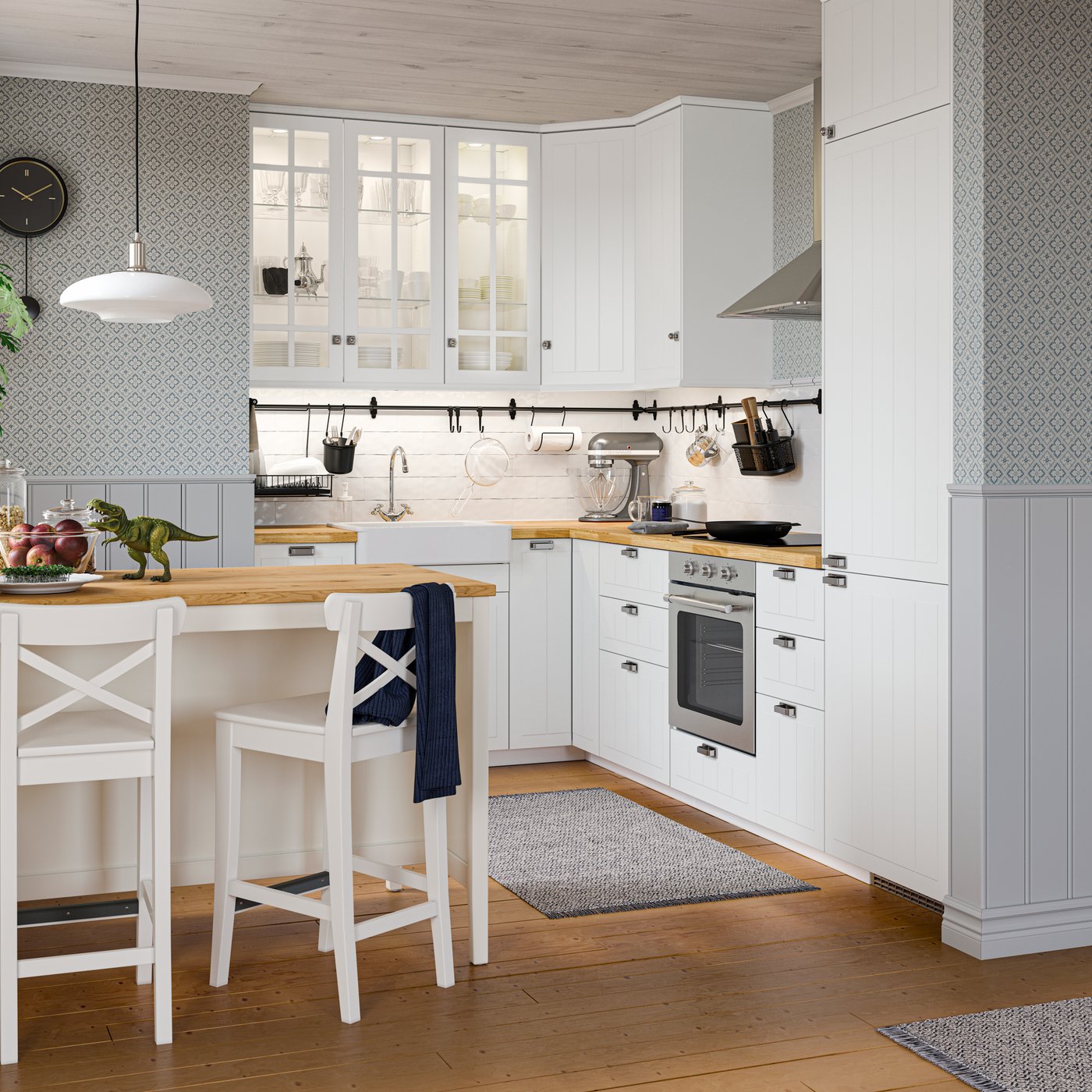 A TÄLLBYN nickel-plated/white opal glass pendant lamp in the kitchen