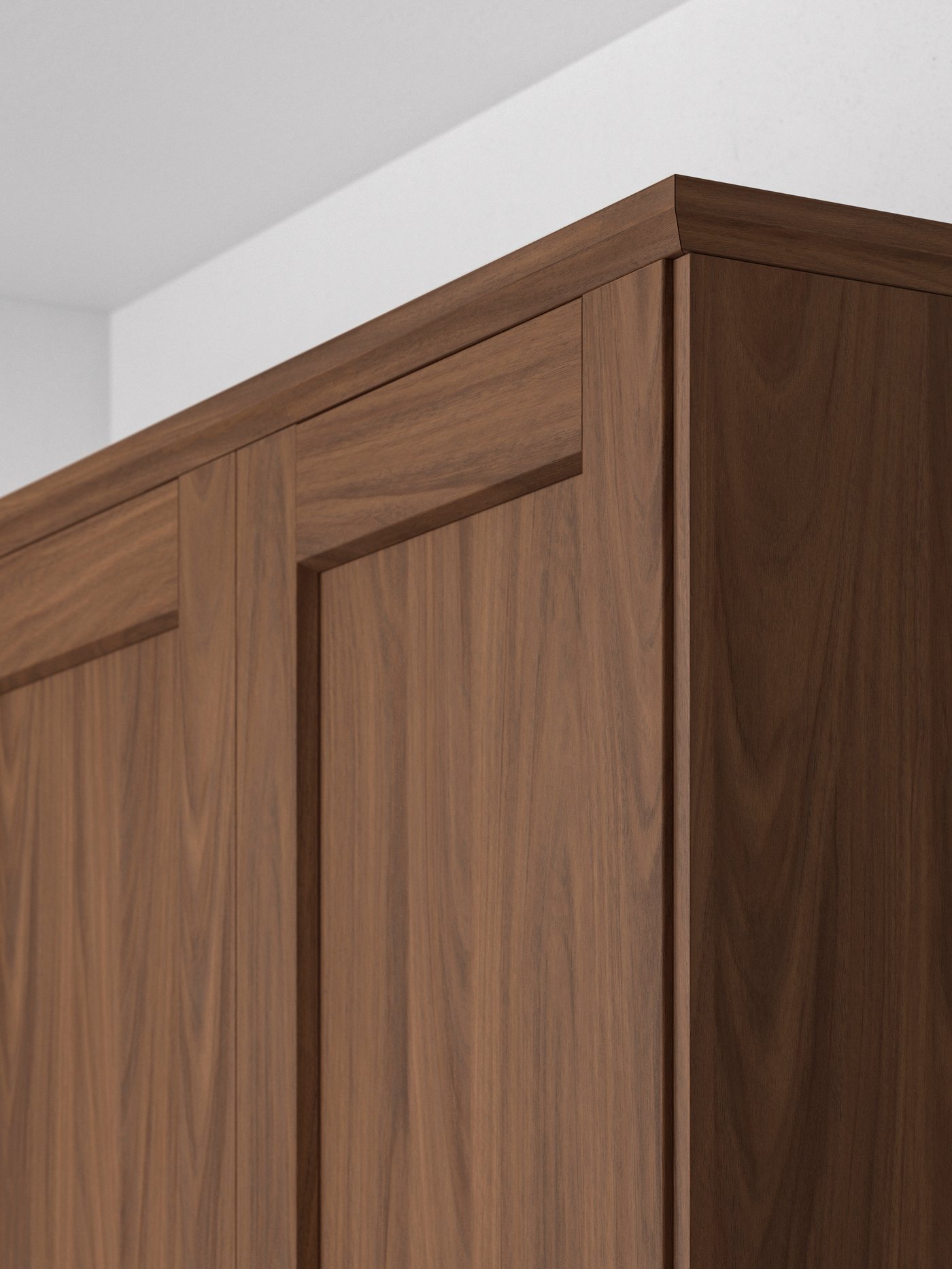 A walnut cabinet with two doors, ENKÖPING deco strip with brown walnut effect in the corner of a room with white walls.