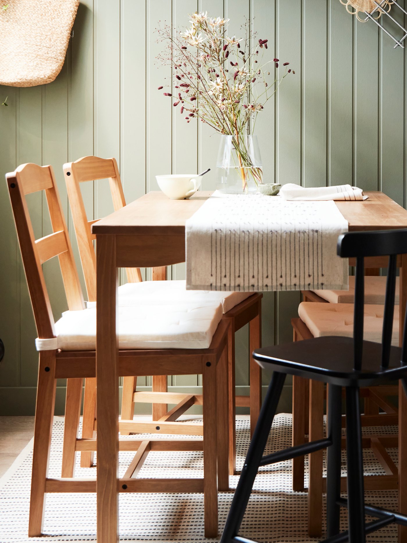 An antique stain pine HÄGERNÄS table and 4 chairs in the dining room