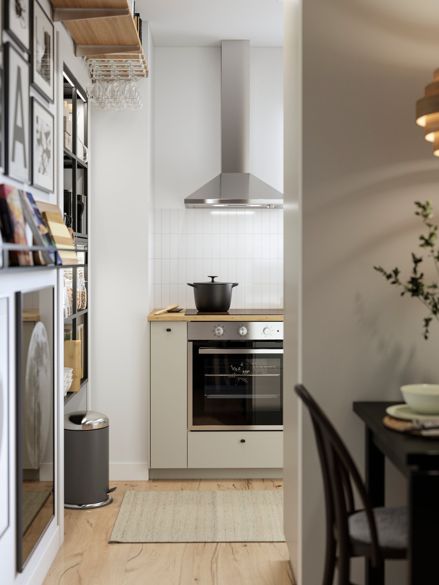 A kitchen with beige HAVSTORP fronts is seen from the dining area and there’s a black drop-leaf table in the foreground.