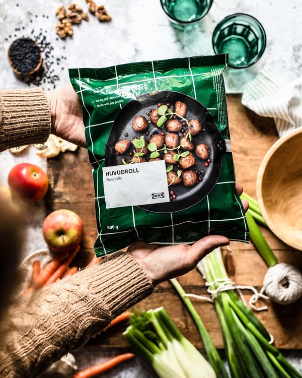 An unopened pack of plant balls above a cutting board