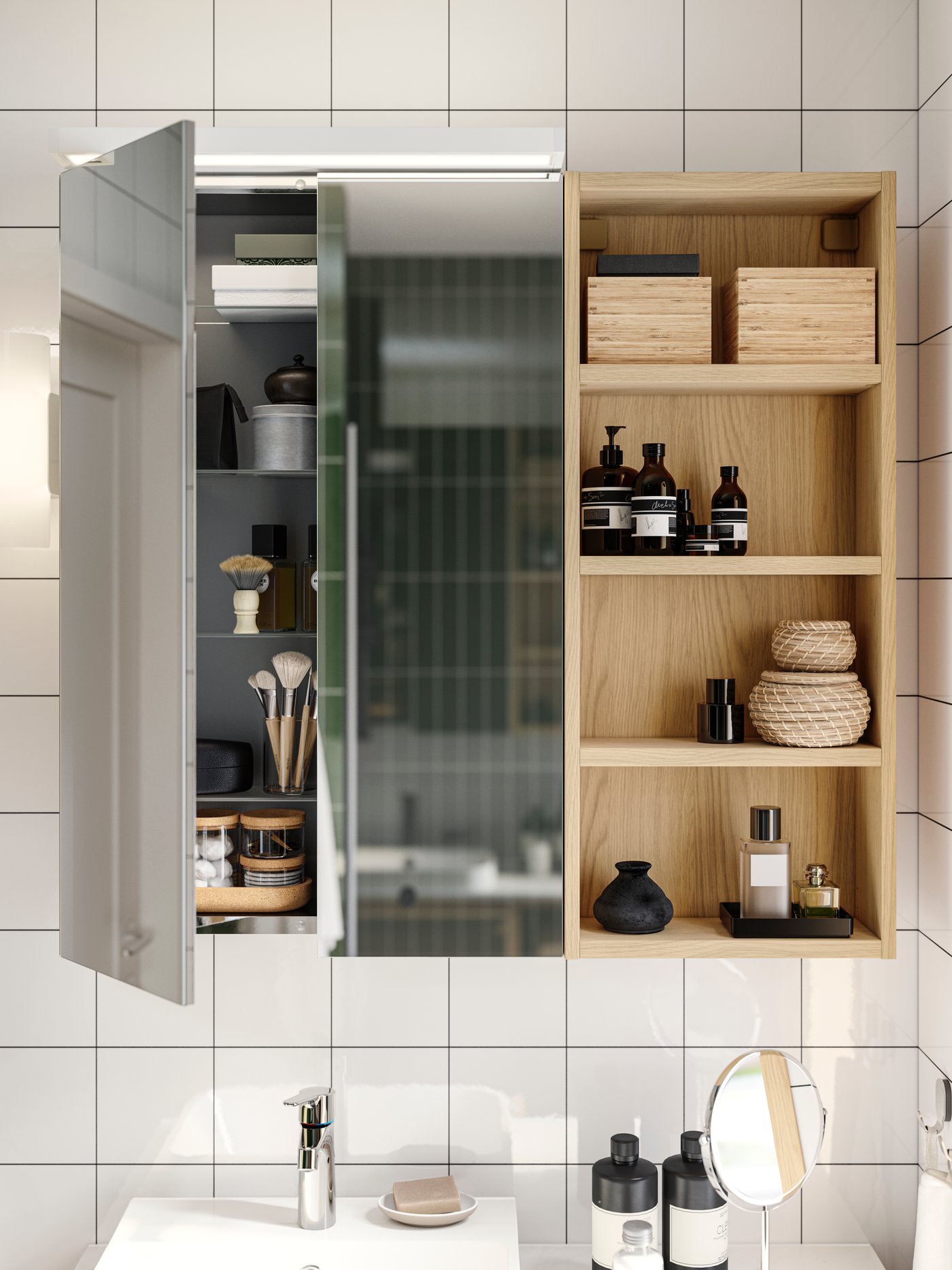 A bathroom cabinet with a mirror and open wooden shelves, filled with various toiletries, is mounted on a white tiled wall above a sink.