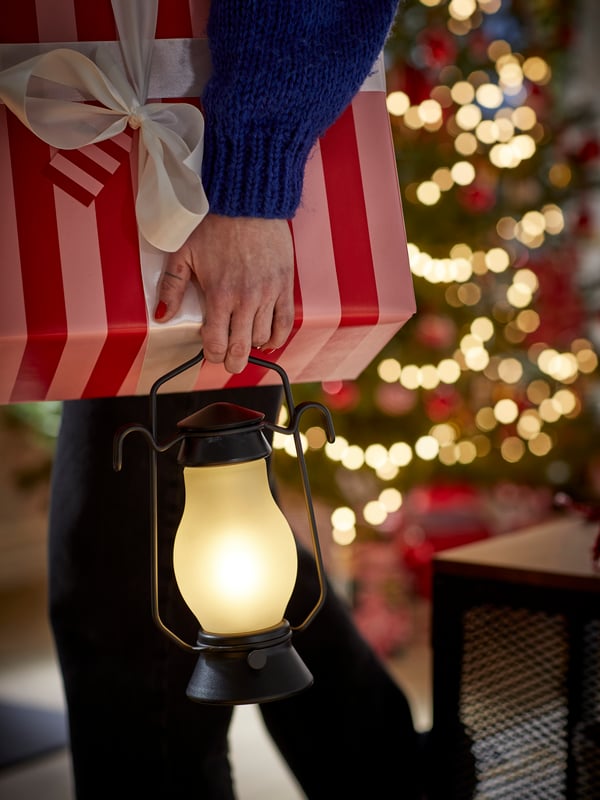 An outdoor metal/dimmable black STRÅLA LED table lamp in the living room