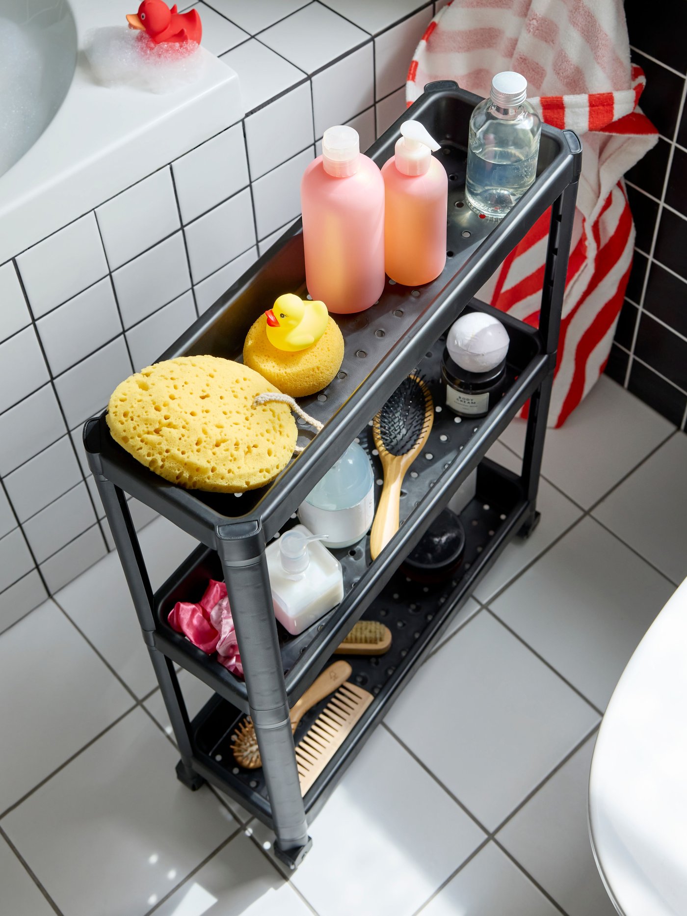 A black VESKEN trolley in the bathroom