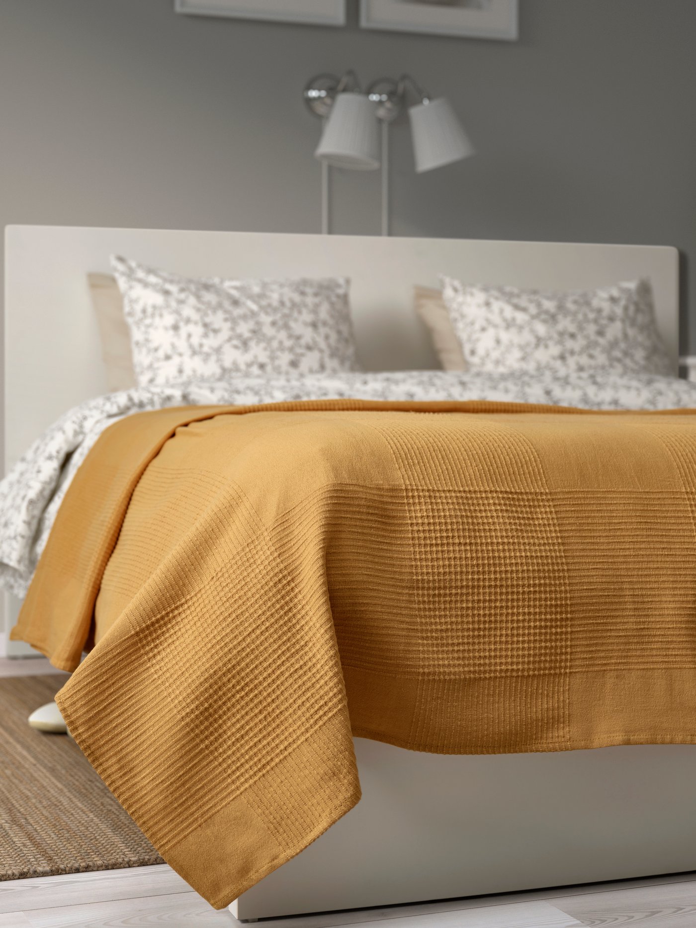 An yellow-beige INDIRA bedspread