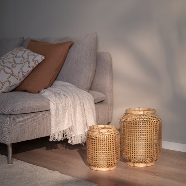 A bamboo PÅVEFINK lantern for pillar candle