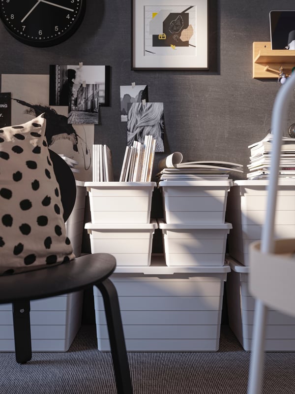 SOCKERBIT stacked white boxes behind a gray chair