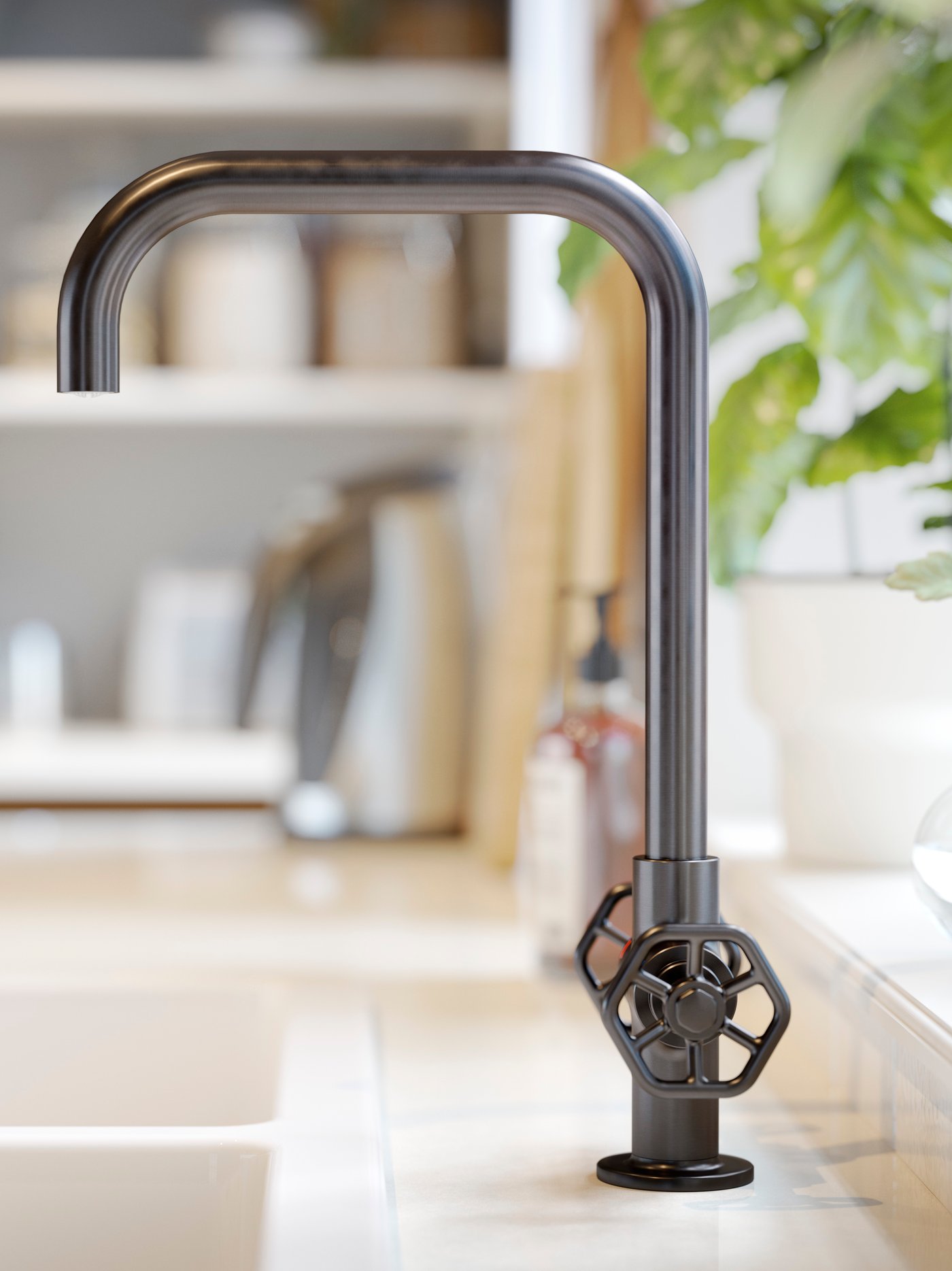 A close-up of an IKEA GAMLESJÖN dual-control kitchen mixer tap in brushed black metal.