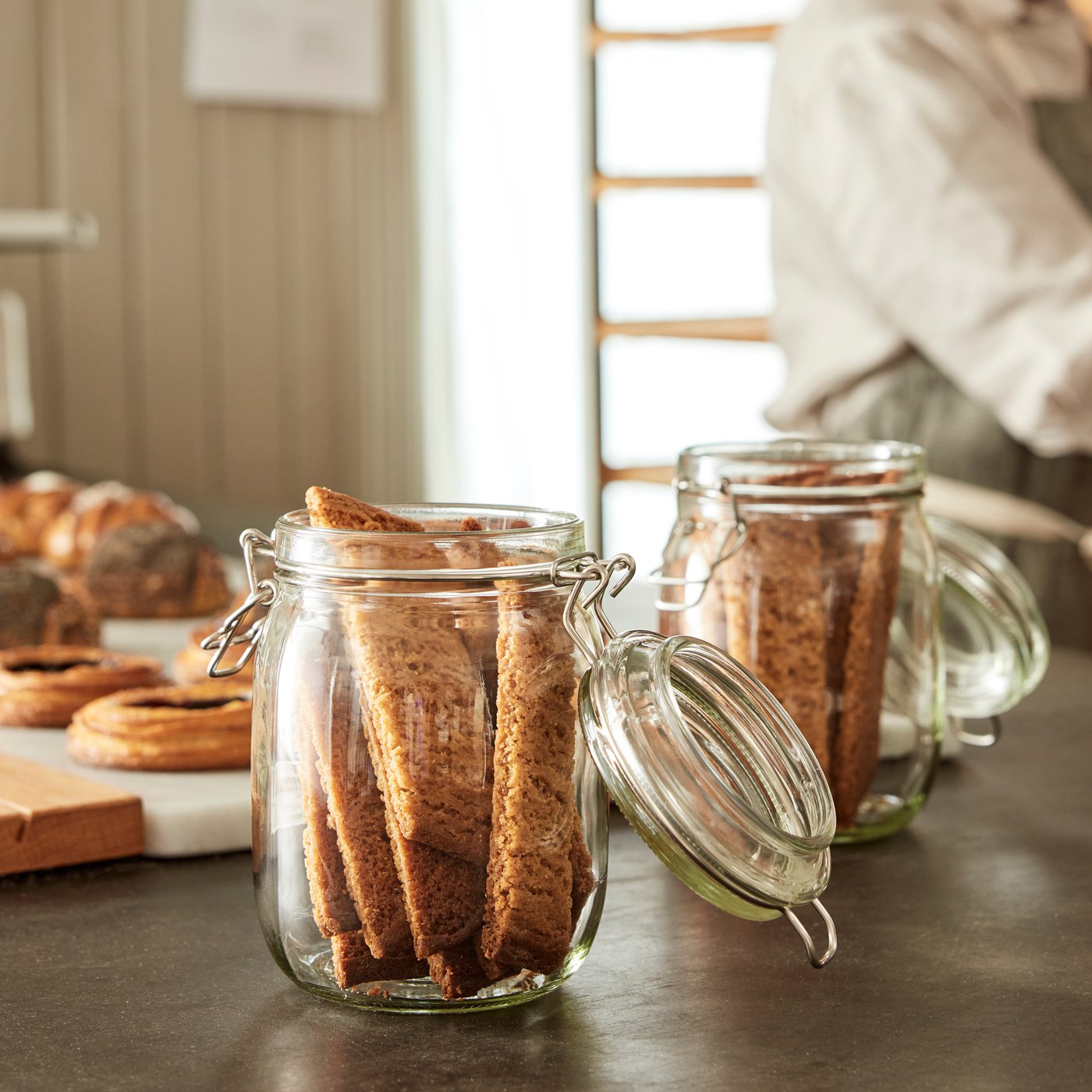A clear glass KORKEN jar with lid