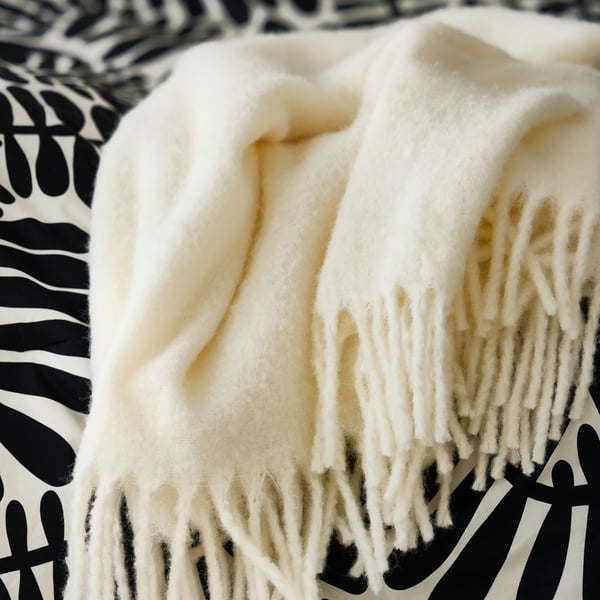A black/white MAJSMOTT comforter set in the bedroom