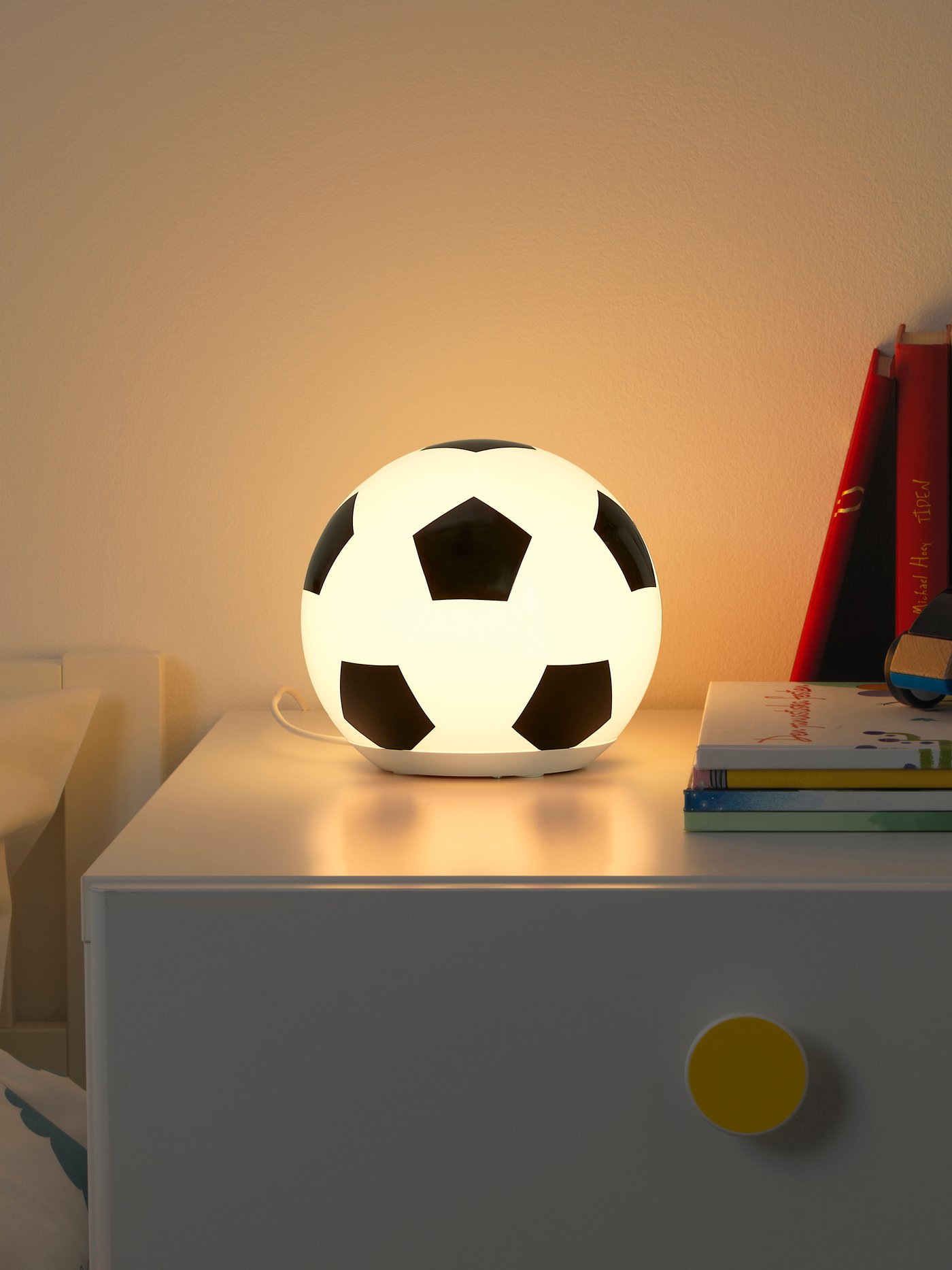 A football pattern ÄNGARNA LED table lamp in the childrens room