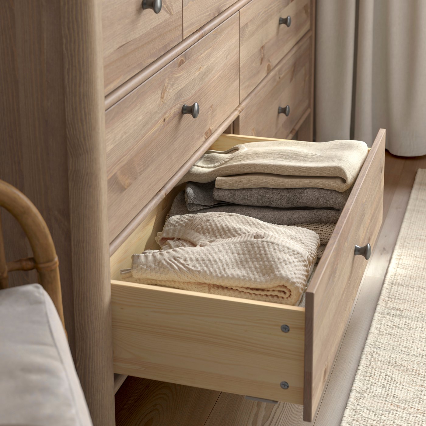 A grey-brown stained STOREMOLLA chest of 8 drawers