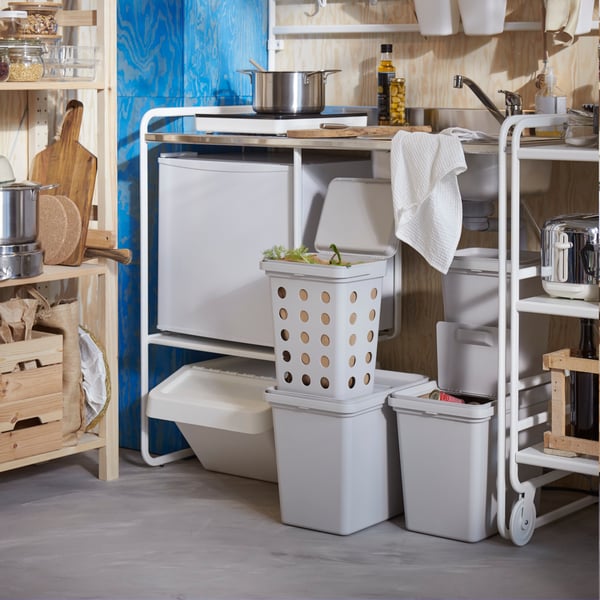 A pine IVAR shelving unit in the kitchen