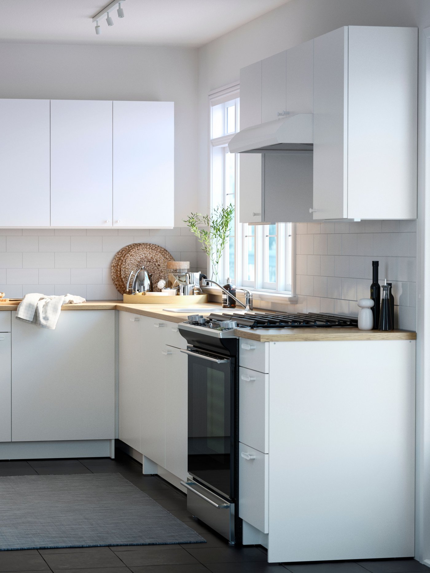 A white KNOXHULT base cabinet with doors and drawer in the kitchen